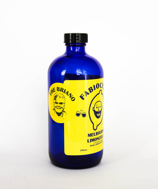 Blue bottle with yellow label featuring a face and text on a white background